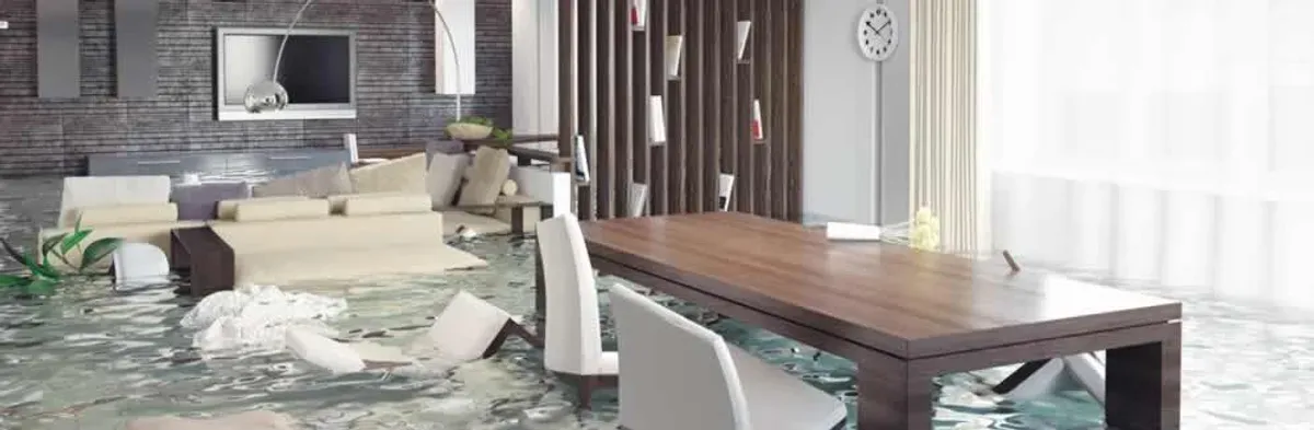 home interior affected by water damage with flooded floors and displaced furniture in Cleveland, OH